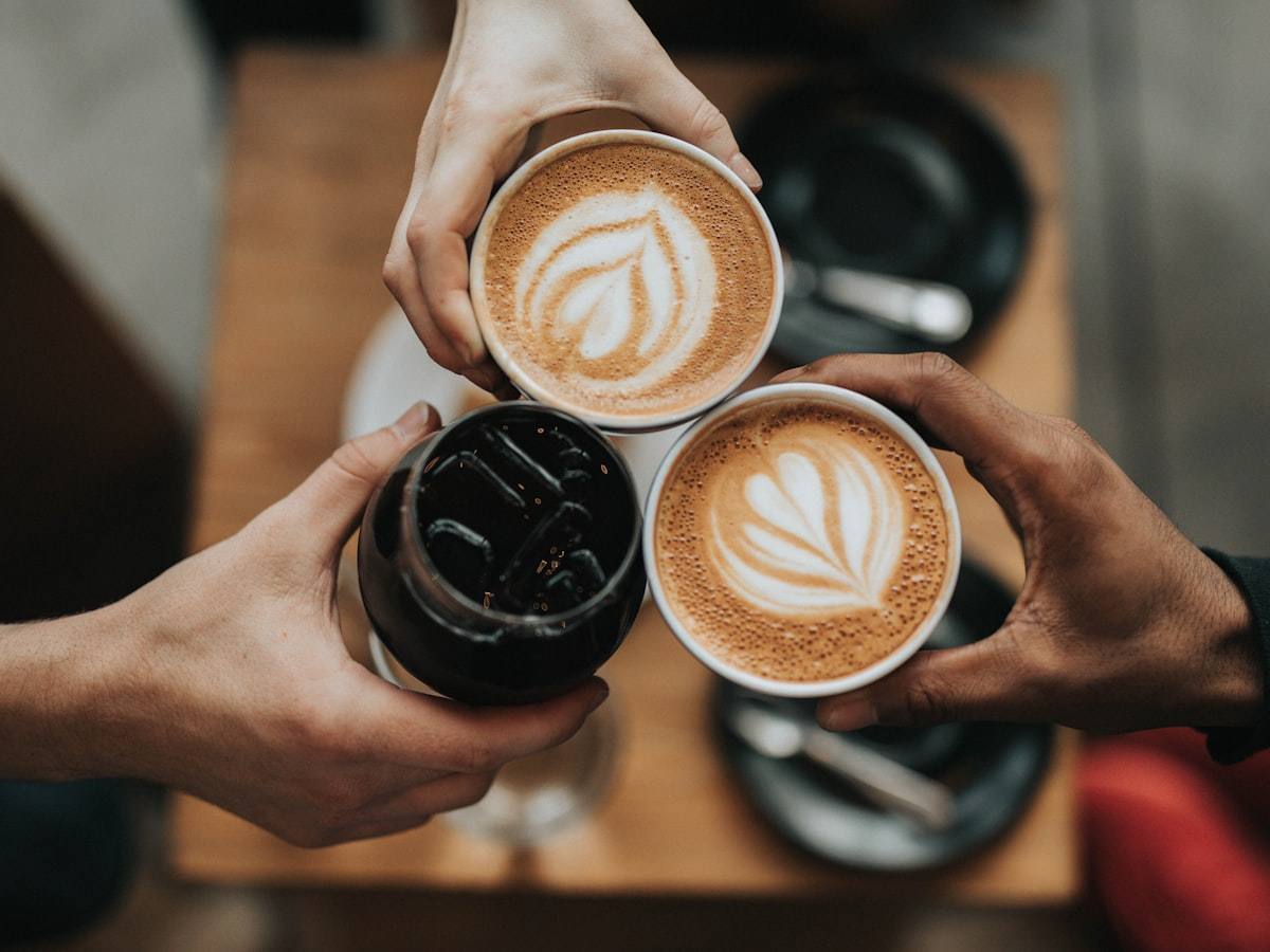 Barista preparing drinks at a coffee shop counter