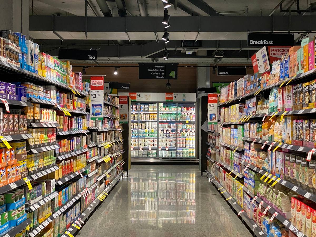 Convenience store aisle with shelves of products